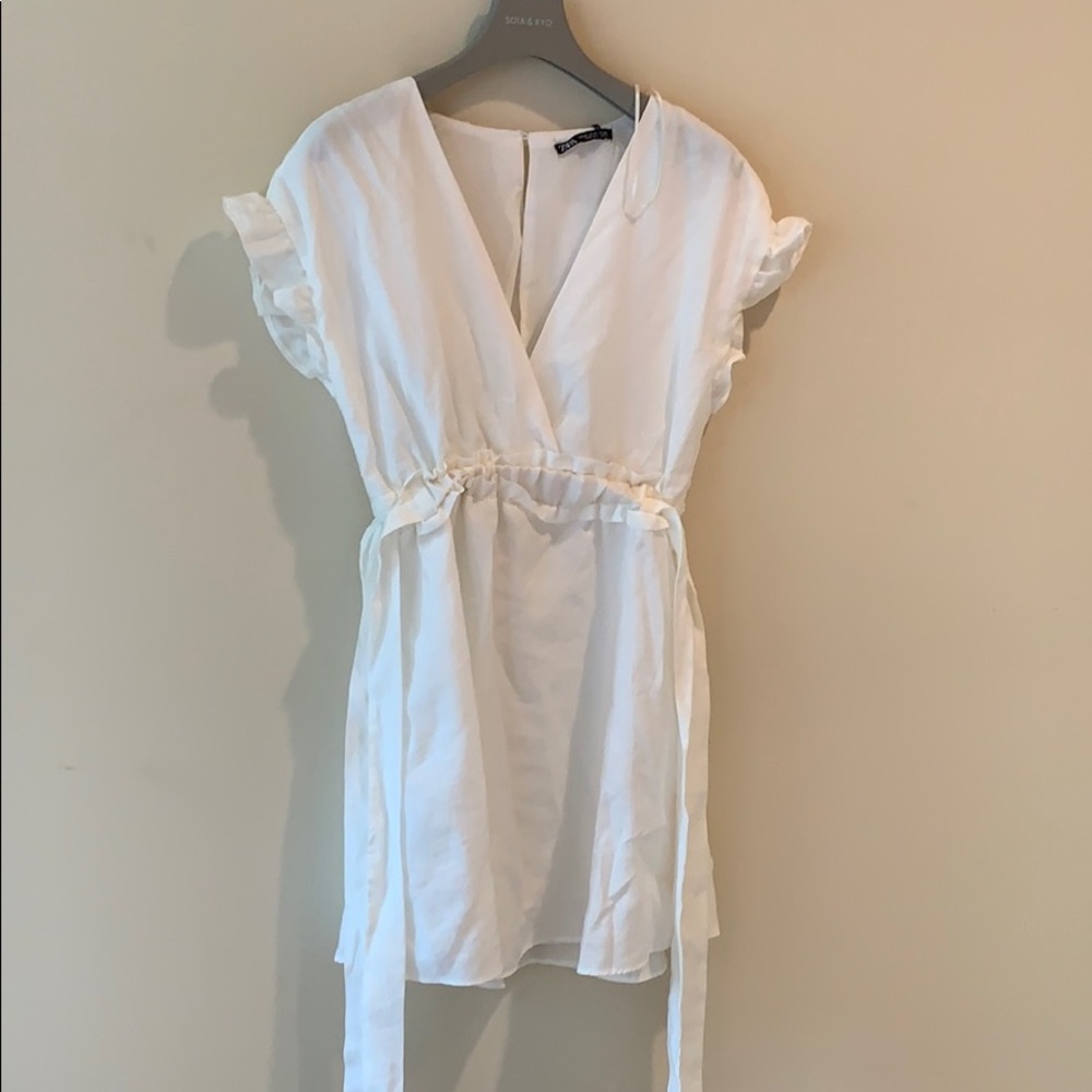 White dress + complementary earrings.